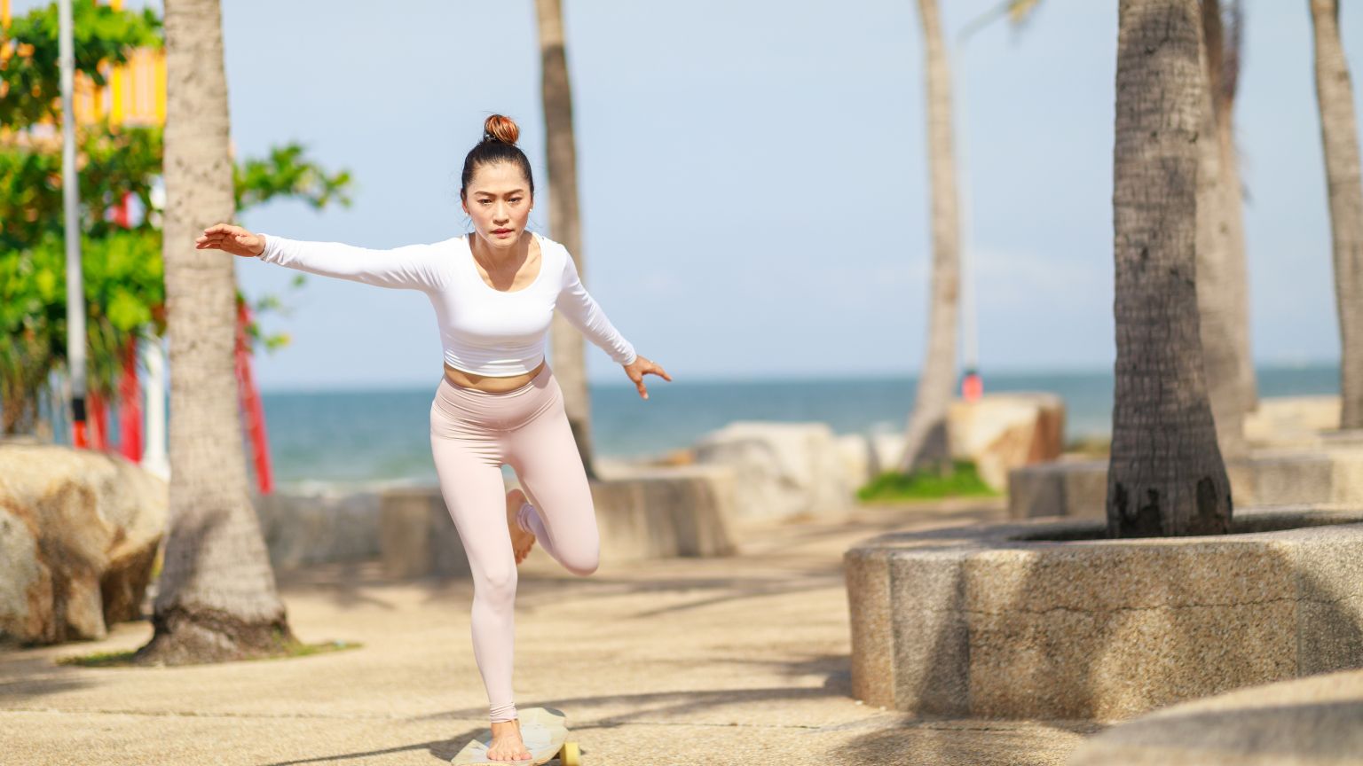 Person using surfskate for surf training, improving balance and technique.