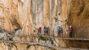 Aerial view of the Caminito del Rey in Málaga, Spain, with suspended walkways over the Gaitanes Gorge and stunning natural landscapes.