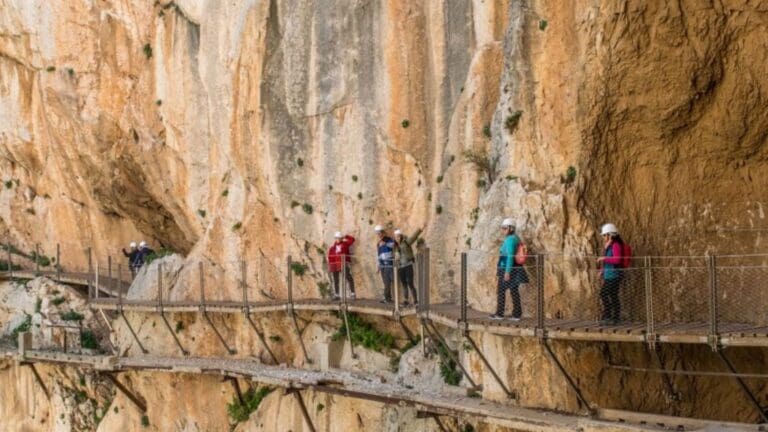 Aerial view of the Caminito del Rey in Málaga, Spain, with suspended walkways over the Gaitanes Gorge and stunning natural landscapes.