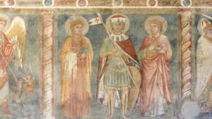 Detalle de obra de arte medieval con fuerte carga simbólica, típica del lenguaje visual sacro y doctrinal de la Edad Media.